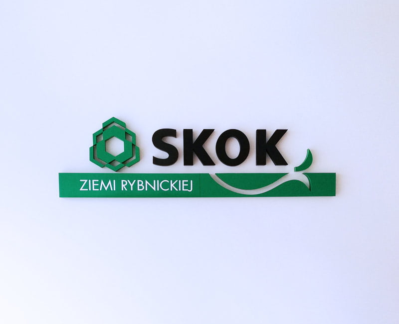 Agencja Reklamowa EFEKT Dębica Logo przestrzenne ze styroduru umieszczone na ścianie firmy SKOK.
